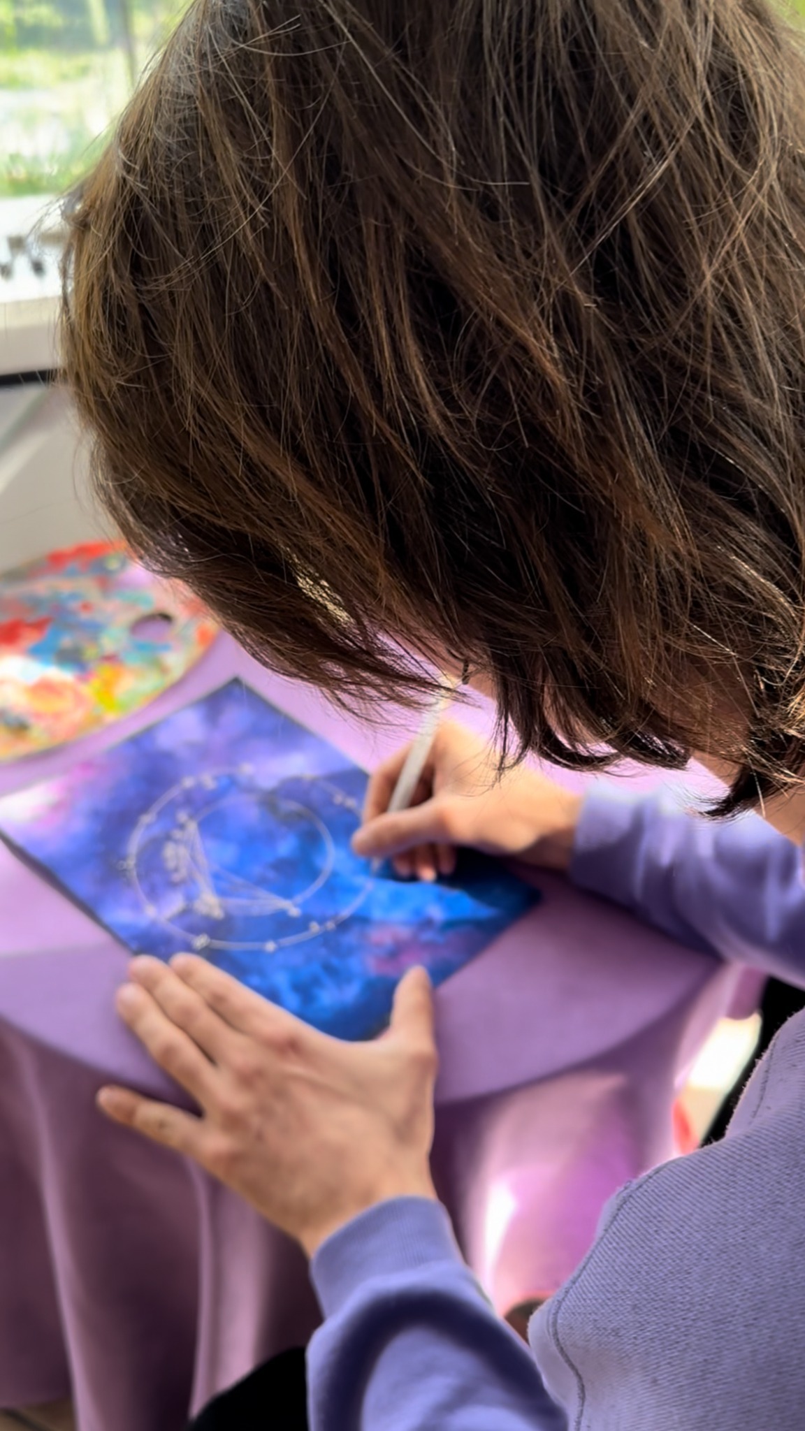 Giulia drawing an astral painting